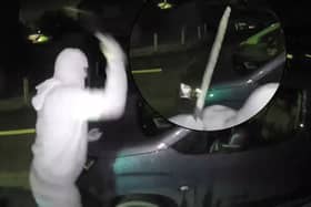 Nathan Smith, 33, has been jailed for 5 years. Here he is smashing the windscreen of a vehicle, while wearing a balaclava, gloves and brandishing a machete.