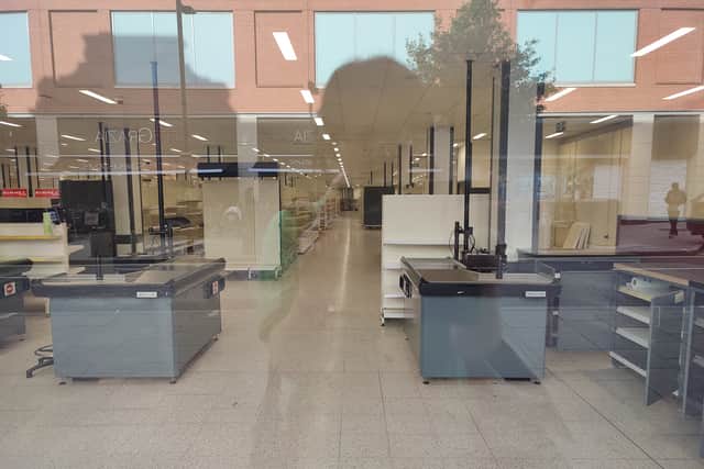 Vacant shelves and an empty shop floor can be seen through the window of the wilko branch at its Derby city centre location